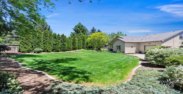 1563 W Colville Ct, Eagle, ID 83616 - view of yard with an attached garage