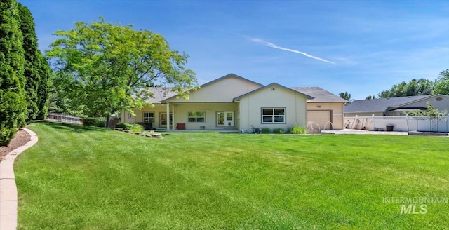 1563 W Colville Ct, Eagle, ID 83616 - back of property with a fenced backyard and a garage