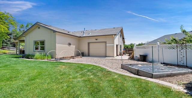 1563 W Colville Ct, Eagle, ID 83616 - back of house featuring an attached garage and a garden