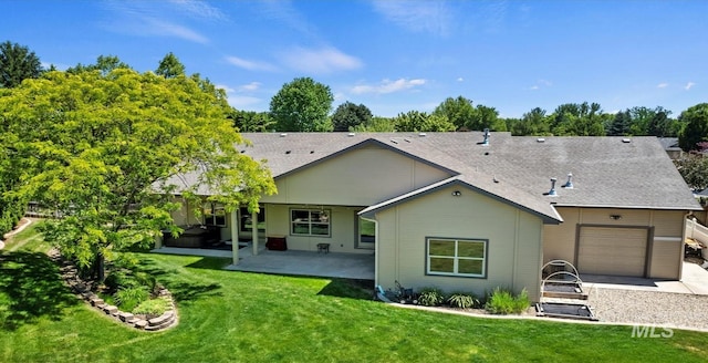 1563 W Colville Ct, Eagle, ID 83616 - back of property featuring a garage, a yard, a patio area, and a shingled roof