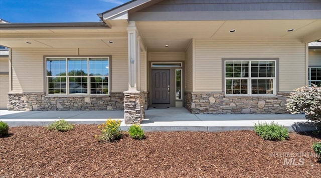 1563 W Colville Ct, Eagle, ID 83616 - entrance to property with stone siding and a porch
