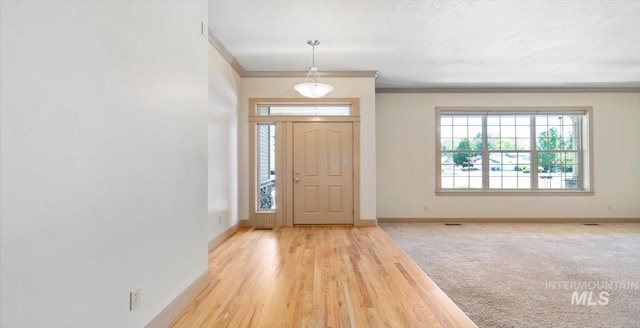 1563 W Colville Ct, Eagle, ID 83616 - foyer entrance featuring ornamental molding and wood finished floors