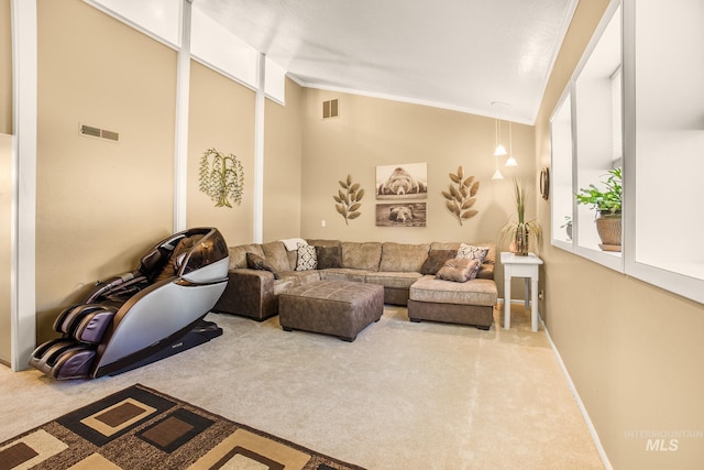 living room with carpet flooring, crown molding, vaulted ceiling, and visible vents