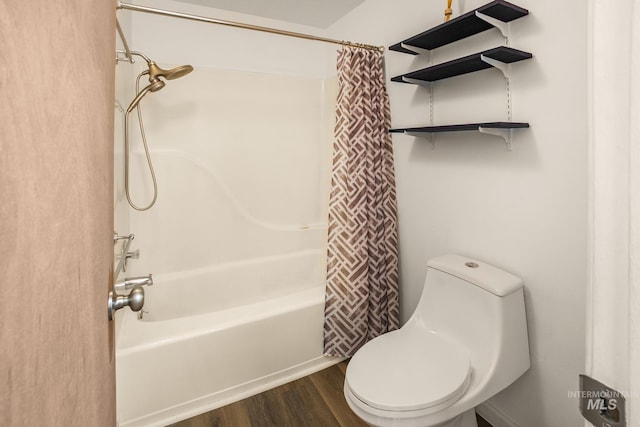 full bath featuring toilet, wood finished floors, and shower / bath combo with shower curtain