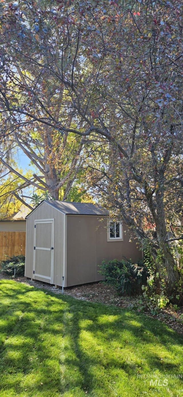 view of shed with fence