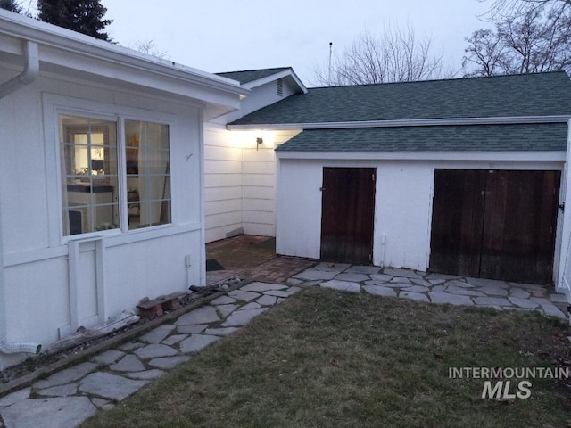 doorway to property featuring a yard