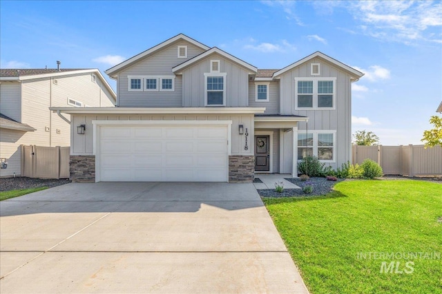 19118 Ralston Way, Caldwell, ID 83605 - view of front of house with board and batten siding, stone siding, concrete driveway, and an attached garage
