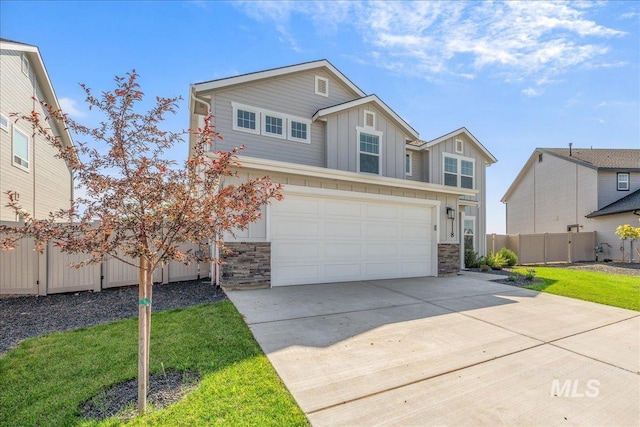 19118 Ralston Way, Caldwell, ID 83605 - view of front of home featuring board and batten siding, stone siding, concrete driveway, and a garage