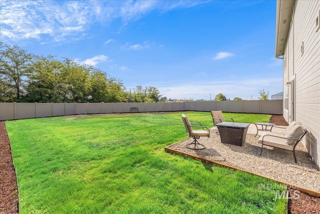 19118 Ralston Way, Caldwell, ID 83605 - fenced backyard with a fire pit and a patio