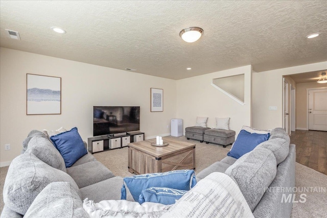19118 Ralston Way, Caldwell, ID 83605 - living room with carpet floors, recessed lighting, a textured ceiling, and wood finished floors