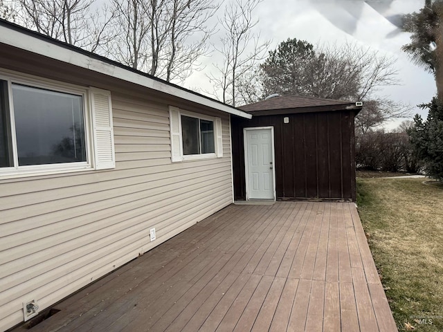 wooden deck with a yard