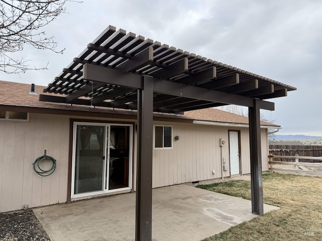 view of patio / terrace featuring a pergola and fence