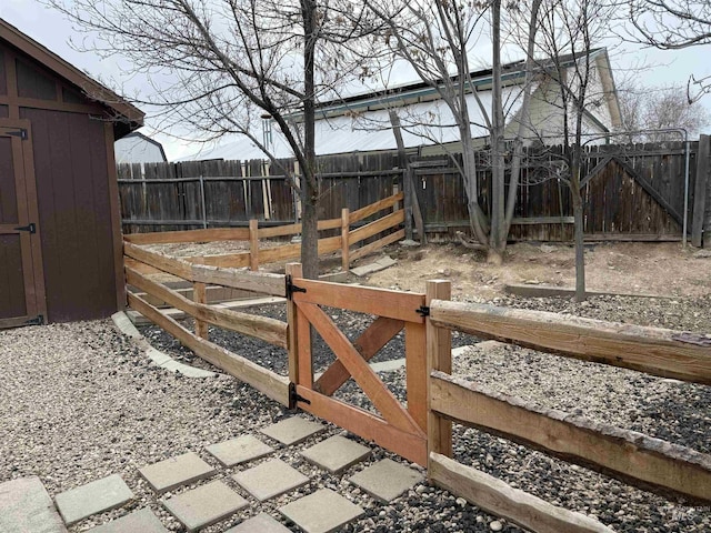 view of yard with an outbuilding and a fenced backyard