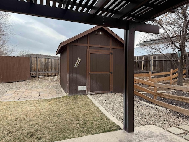 view of shed with a fenced backyard