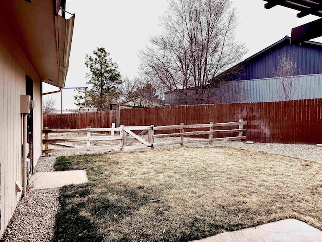 view of yard with a fenced backyard