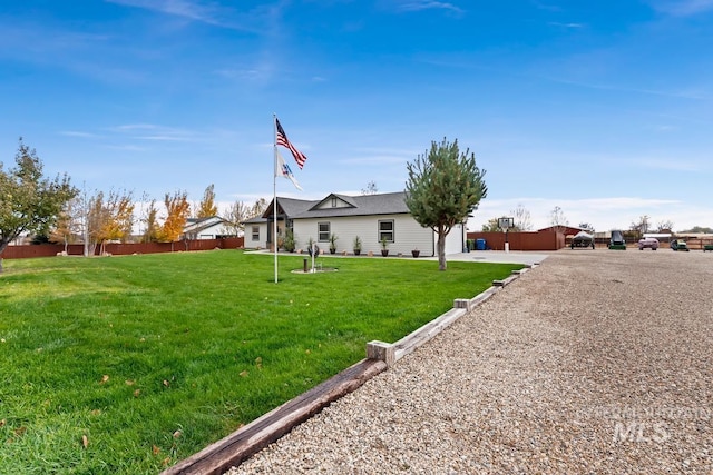 single story home featuring a front yard