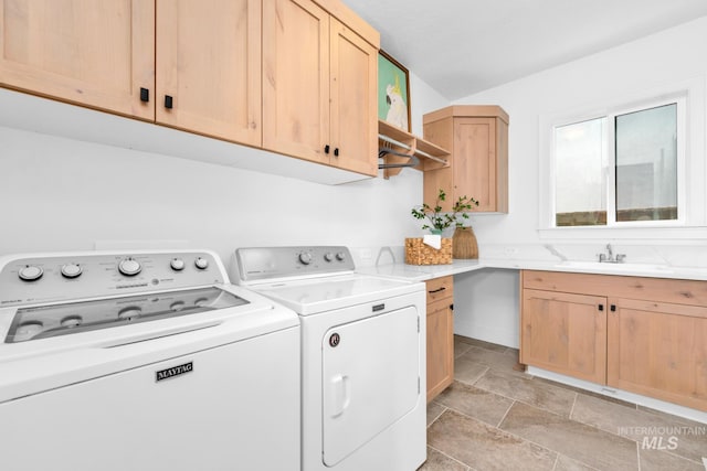 7060 E La Cuesta St, Boise, ID 83716 - washroom featuring separate washer and dryer, light stone finish flooring, and cabinet space