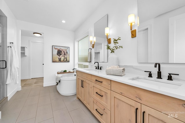 7060 E La Cuesta St, Boise, ID 83716 - full bath with double vanity, a soaking tub, a shower stall, tile patterned flooring, and baseboards
