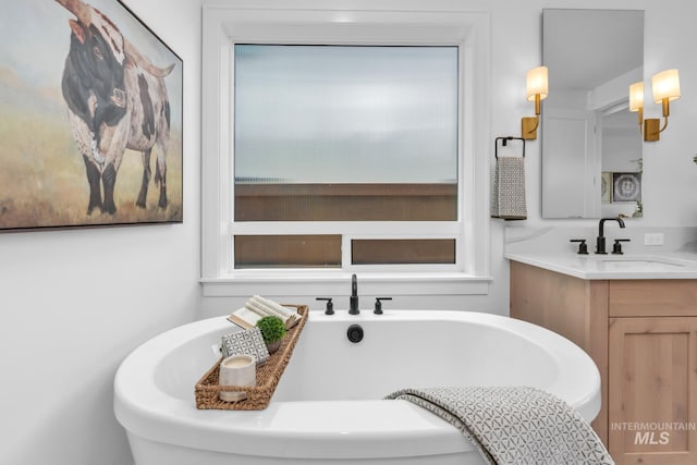 7060 E La Cuesta St, Boise, ID 83716 - bathroom featuring a freestanding bath and vanity