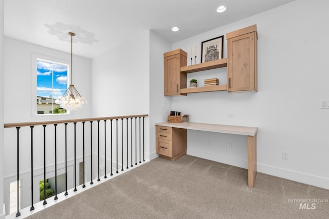 7060 E La Cuesta St, Boise, ID 83716 - unfurnished office featuring carpet flooring, baseboards, recessed lighting, and built in desk