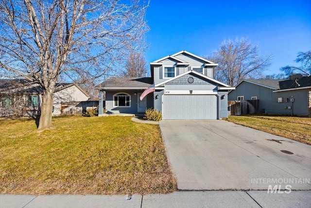 view of front property featuring a garage and a front yard