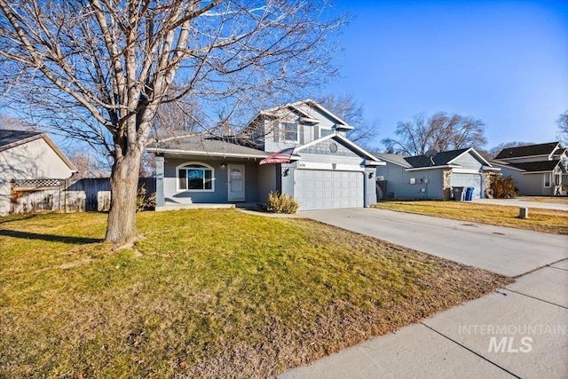 view of front property featuring a garage and a front yard