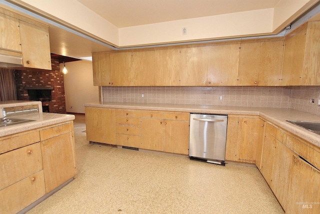 kitchen featuring light brown cabinetry, stainless steel dishwasher, and light countertops