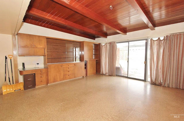 unfurnished living room with wood ceiling and beam ceiling