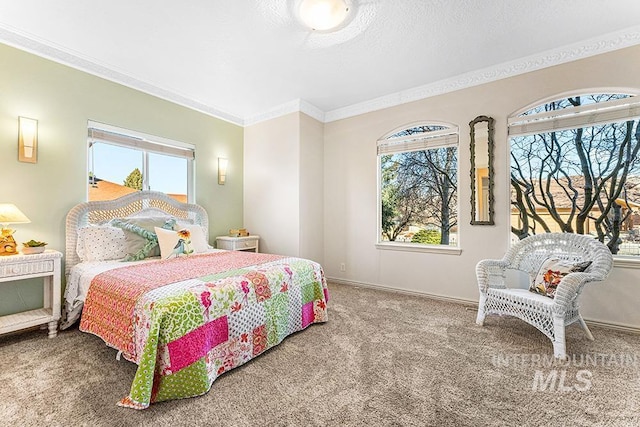 carpeted bedroom with ornamental molding and multiple windows