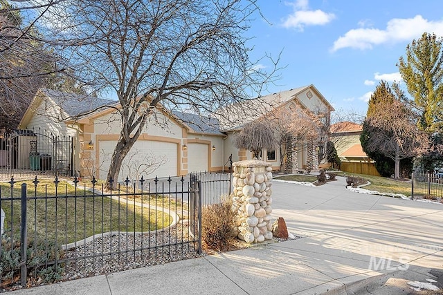 view of front facade with a garage and a front lawn