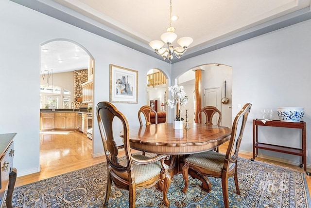 dining area featuring an inviting chandelier and light wood-type flooring