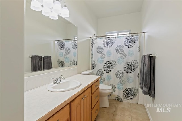 full bath featuring vanity, tile patterned flooring, toilet, and a shower with shower curtain