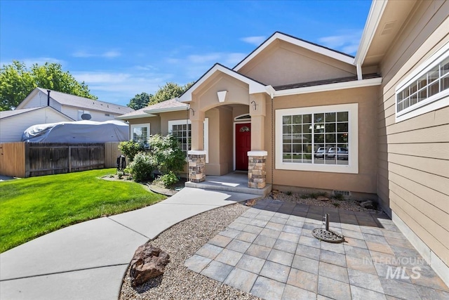 property entrance featuring stucco siding