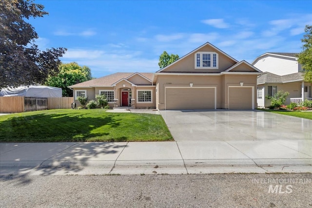 view of front facade with an attached garage, driveway, and stucco siding
