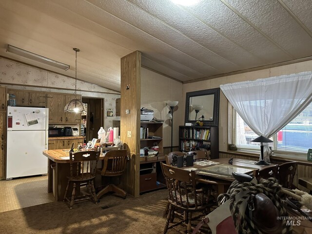 46 Aspen Way, Lowman, ID 83637 - carpeted dining room featuring vaulted ceiling, a desk, and wallpapered walls