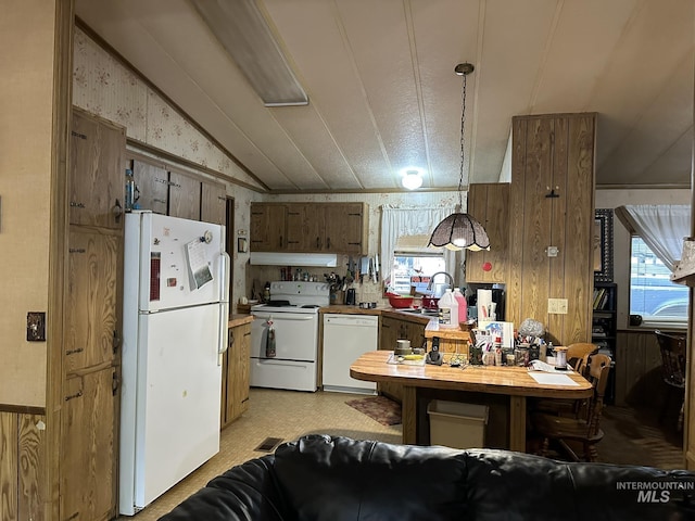 46 Aspen Way, Lowman, ID 83637 - kitchen featuring white appliances, a sink, healthy amount of natural light, vaulted ceiling, and range hood