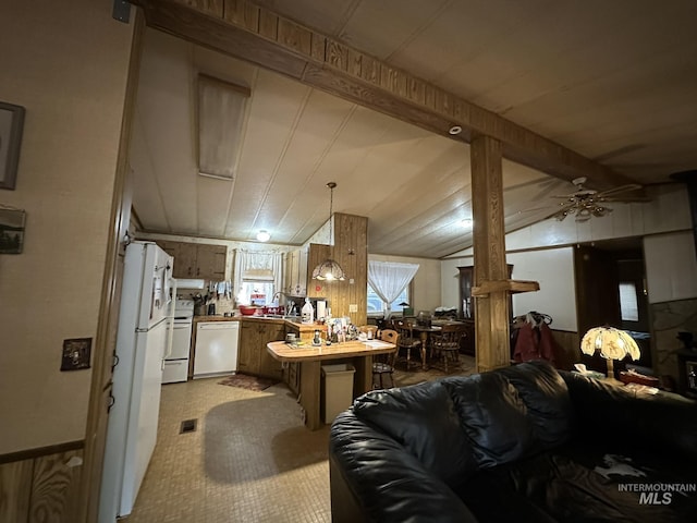 46 Aspen Way, Lowman, ID 83637 - kitchen featuring white appliances, a peninsula, open floor plan, brown cabinetry, and ceiling fan