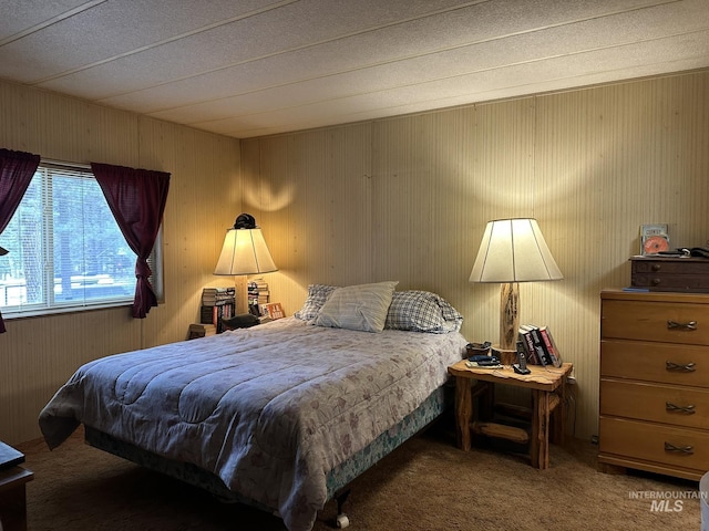 46 Aspen Way, Lowman, ID 83637 - carpeted bedroom featuring wooden walls