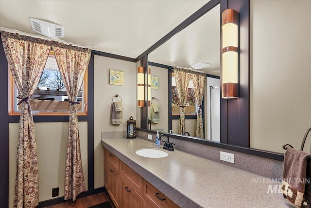 bathroom with visible vents and vanity
