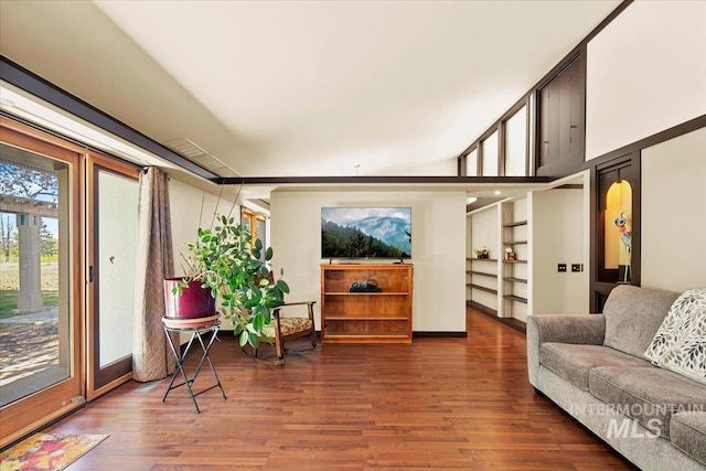 living room with baseboards and wood finished floors