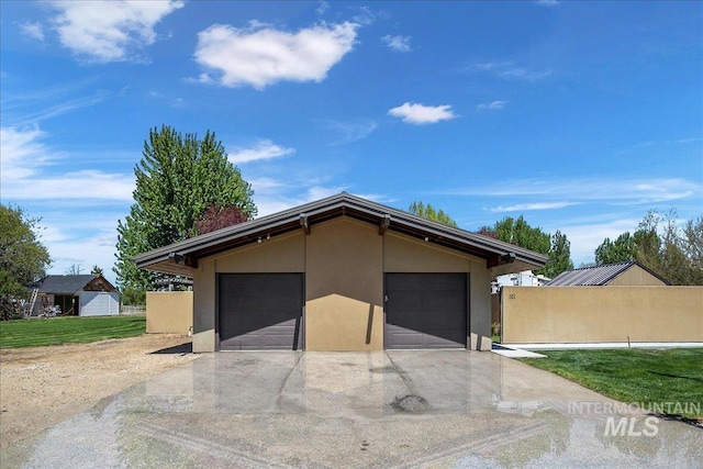 garage featuring fence