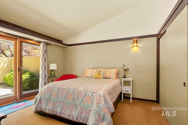 carpeted bedroom featuring access to outside, baseboards, vaulted ceiling, and a closet