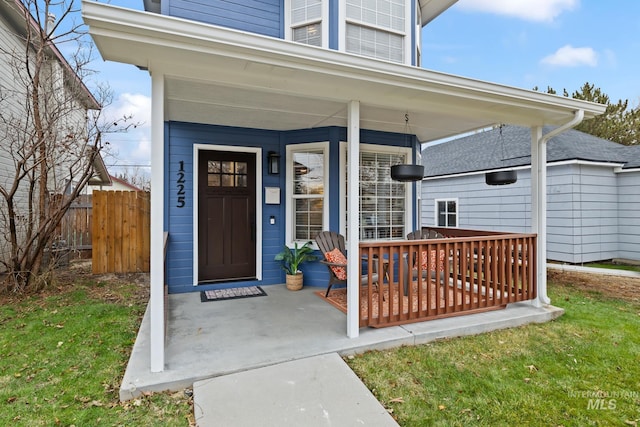 doorway to property featuring covered porch