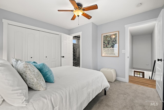 bedroom with carpet, ceiling fan, and a closet