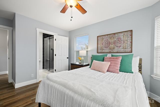 bedroom featuring ceiling fan, dark wood-type flooring, and connected bathroom