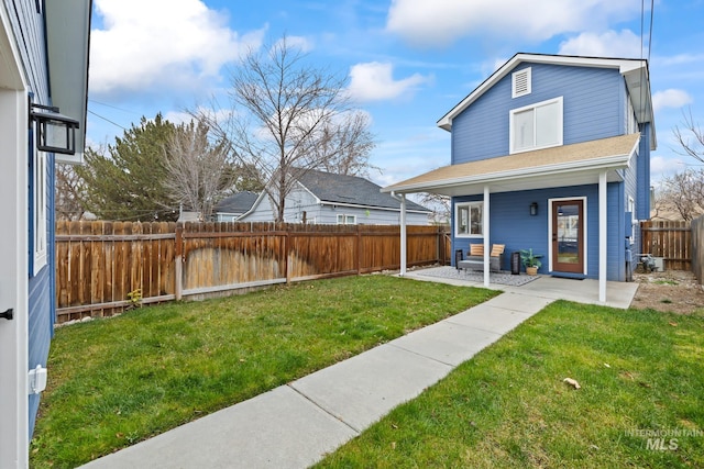 exterior space featuring a patio area and a lawn