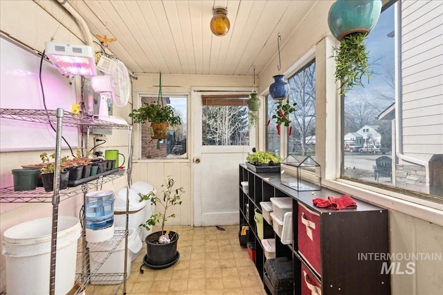 sunroom featuring wooden ceiling