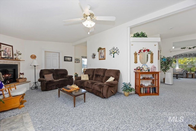 321 S 600 E, Jerome, ID 83338 - living area featuring carpet flooring, a tiled fireplace, and ceiling fan
