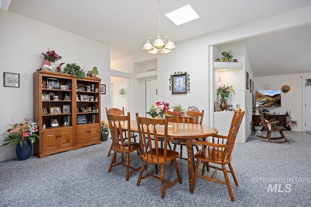 321 S 600 E, Jerome, ID 83338 - dining room with light carpet, a chandelier, and a skylight