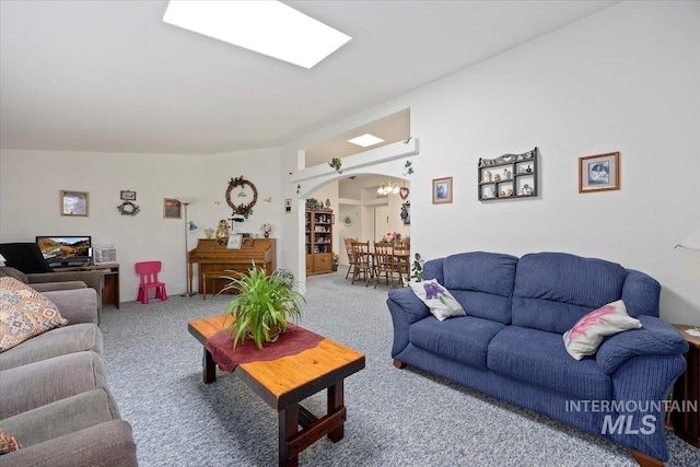 321 S 600 E, Jerome, ID 83338 - living room featuring arched walkways and carpet flooring